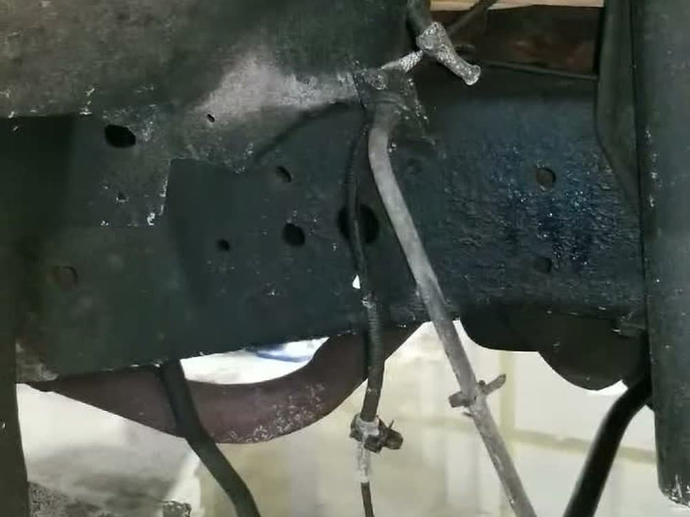 A freshly coated truck frame after FLUID FILM application at Underline Undercoating